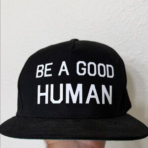 Black flat billed snap back hat